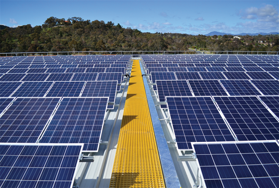 Close up view of solar PV panels on the rooftop of a hospital.